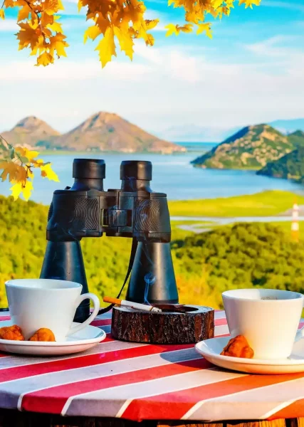 Binoculars on a table overlooking Skadar Lake