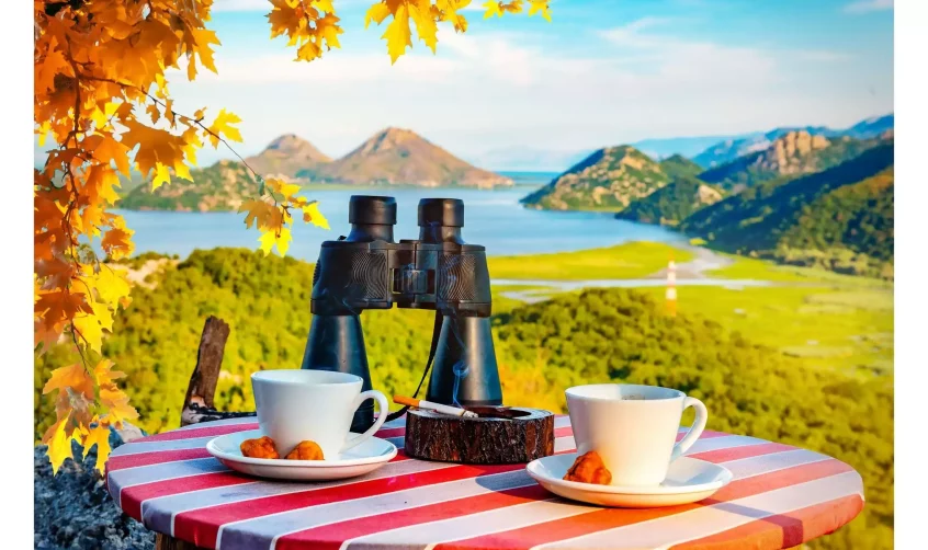 Binoculars on a table overlooking Skadar Lake