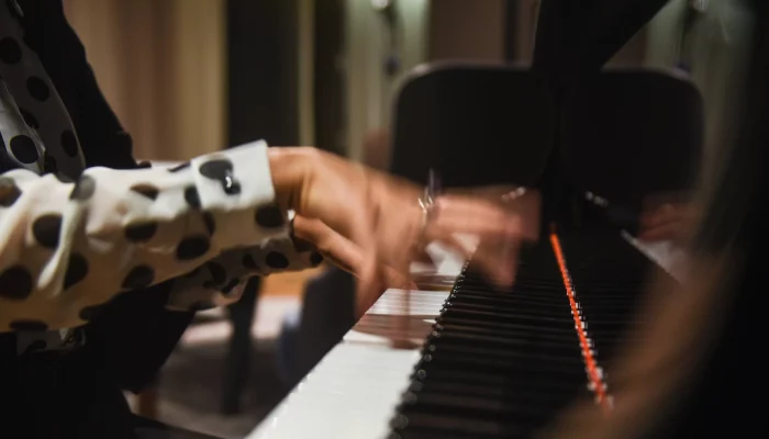 woman playing a piano