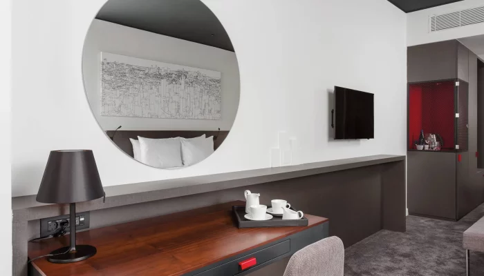 hotel desk with mirror above it